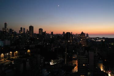 Unlit buildings are seen during a partial blackout in Beirut, Lebanon August 11, 2021. (File photo: Reuters)