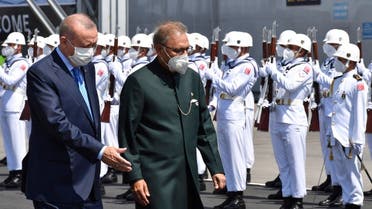 Turkey’s President Recep Tayyip Erdogan, left, and Pakistan’s President Arif Alvi review a guard of honor during a naval ceremony, in Istanbul, Turkey, August 15, 2021. (Turkish Presidency via AP, Pool)