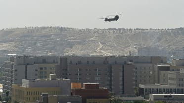 A US military helicopter is pictured flying above the US embassy in Kabul on August 15, 2021. (AFP)