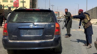 Members of Taliban forces gesture as they check a vehicle on a street in Kabul, Afghanistan, August 16, 2021. (Reuters/Stringer)
