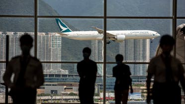 A Cathay Pacific aircraft comes in to land at Hong Kong International Airport on August 11, 2021. (AFP)