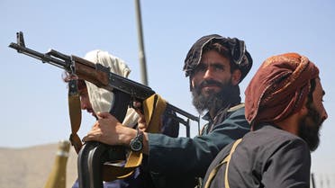 Taliban fighters stand guard in a vehicle along the roadside in Kabul on August 16, 2021, after a stunningly swift end to Afghanistan's 20-year war, as thousands of people mobbed the city's airport trying to flee the group's feared hardline brand of Islamist rule. (File photo: AFP)