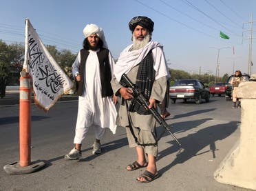 Taliban fighters stand outside the Interior Ministry in Kabul, Afghanistan, August 16, 2021. (Reuters)