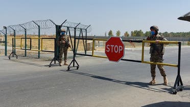 Uzbek soldiers guard a checkpoint, two kilometers from “Friendship Bridge” over the Amu Darya river, which separates Uzbekistan and Afghanistan near Termez on August 15, 2021. (Temur Ismailov/AFP)