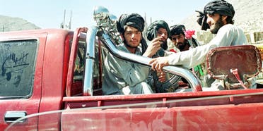 Afghan Taliban fighters sit in the back of a pick up truck on the way to the frontline north of Kabul, 27 September 2001.(File photo: AFP)