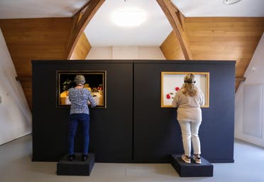 Visitors interact during the exhibition The Blind Spot by artist Jasper Udink ten Cate and experience designer Jeroen Prins, aimed for blind and visually impaired visitors to appreciate art by touching and smelling at Centraal Museum in Utrecht, Netherlands, August 14, 2021. Picture taken August 14, 2021. (Reuters)
