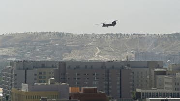 A US Chinook military helicopter flies above the US embassy in Kabul on August 15, 2021. (AFP)
