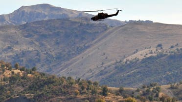 A Turkish military helicopter flies over a mountain in Yemisli, Hakkari province near the Iraqi border in southeastern Turkey, on October 22, 2011. (AFP/Mustafa Ozer)
