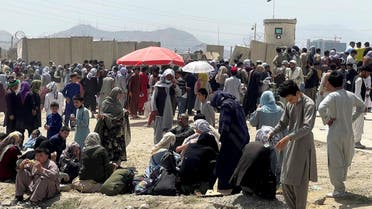 People wait outside Hamid Karzai International Airport in Kabul, Afghanistan August 17, 2021. REUTERS/Stringer NO RESALES. NO ARCHIVES