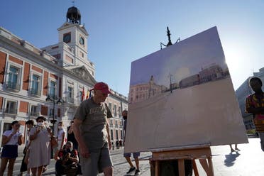 Spanish artist Antonio Lopez prepares to paint the famous Puerta del Sol square in Madrid, Spain, August 5, 2021. Picture taken August 5, 2021. REUTERS/Juan Medina