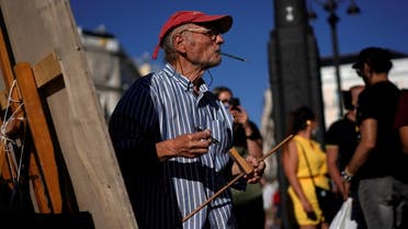 Spanish artist Antonio Lopez looks on during one of the sessions to paint the famous Puerta del Sol square in Madrid, Spain, August 4, 2021. Picture taken August 4, 2021. REUTERS/Juan Medina