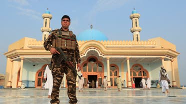 An Afghan security force stands guard outside a mosque before prayers during the Muslim festival of Eid al-Adha, amid the spread of the coronavirus disease (COVID-19), in Jalalabad, Afghanistan July 31, 2020. (Reuters)