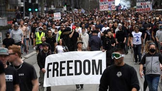 Police arrest hundreds of protesters as Australia reports record COVID-19 cases
