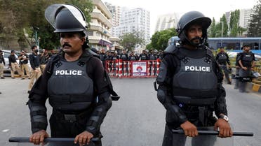 Police officers in riot gear stand guard on a road leading towards the U.S. consulate, in Karachi, Pakistan May 21, 2021. (Reuters)