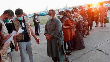 Afghan citizens who were evacuated from Kabul arrive at Torrejon Air Base in Torrejon de Ardoz, outside Madrid, Spain, August 20, 2021. (Reuters)