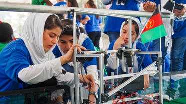 Members of the Afghan all-girls robotics team work with their robot in the practice area on July 17, 2017, between 2017 FIRST Global Challenge competitions at DAR Constitution Hall, in Washington, DC. (File photo: AFP)