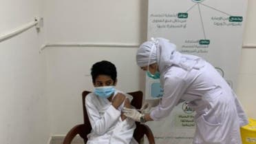 A young Saudi boy receives a COVID-19 vaccine in Saudi Arabia. (Photo Courtesy: Ministry of Education)