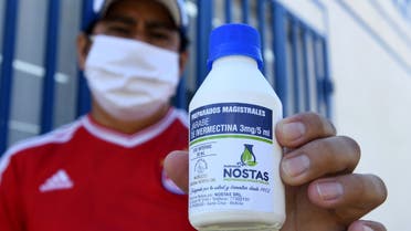 Manuel Negrete holds the anti-parasite drug ivermectin after buying it with a medical prescription at a local pharmacy in Santa Cruz, Bolivia May 19, 2020. (Reuters)