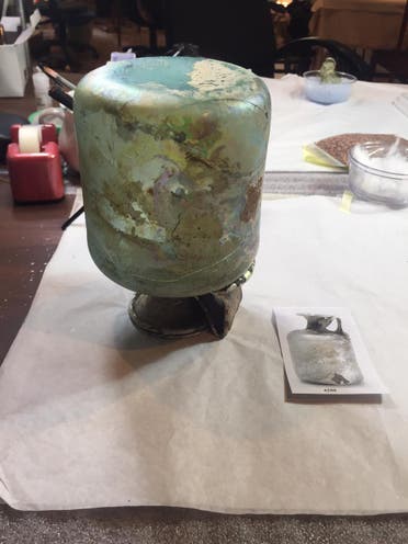The glass artifacts were shattered into fragments when the force of the Beirut port blast from over three kilometers away struck AUB’s Archeological Museum throwing over the display. (Image: AUB Archeological Museum)
