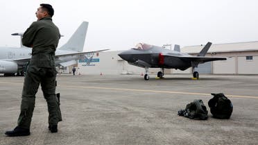 A South Korean fighter pilot stands next to his F-35 stealth fighter during a ceremony to mark the 71st Armed Forces Day at the Air Force Base in Daegu, South Korea, October 1, 2019. (Jeon Heon-kyun/Pool via Reuters)