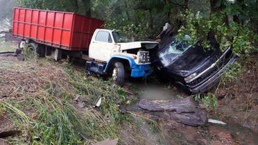 A truck and a car sit in a creek August 22, 2021, after they were washed away the day before in McEwen, Tennessee. (AP /Mark Humphrey)