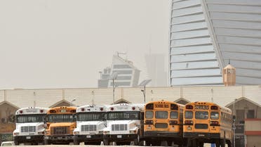 A picture taken March 18, 2020 shows school buses parked in an open area after closure of schools in Riyadh amid measures to combat the novel COVID-19 coronavirus disease. Saudi Arabia called today for a 'virtual' G20 summit over coronavirus. (AFP)