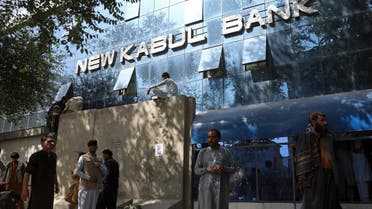 Afghans wait for hours to try to withdraw money, in front of Kabul Bank, in Kabul, Afghanistan, Sunday, Aug. 15, 2021. (AP)