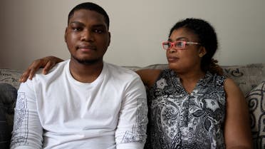 Type 2 diabetes patient Adedotun Adebayo (15) sits with his mother Oyebola Omoyele as they pose for a portrait at their home in Glenarden, Maryland, US, on July 15, 2021. (Reuters)