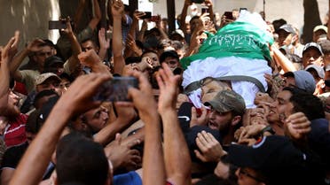 Palestinian mourners carry the body of Osama Deeij during his funeral at Jabalia refugee camp in the northern Gaza Strip on August 25, 2021. (Mohammed Abed/AFP)
