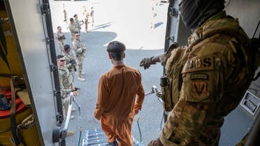 An Afghan evacuee arrives on a C-17 Globemaster III aircraft at Ali Al Salem Air Base, Kuwait, August 23, 2021. (Reuters)