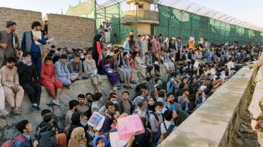 Crowds of people wait outside the airport in Kabul, Afghanistan August 25, 2021 in this picture obtained from social media. (Reuters)