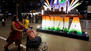 Passengers exit the Chhatrapati Shivaji Maharaj International Airport on the eve of India's 75th Independence Day in Mumbai, India, on August 14, 2021. (Reuters)