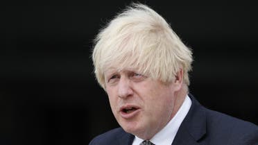 Britain's Prime Minister Boris Johnson leaves following a visit at Northwood Headquarters, the British Armed Forces Permanent Joint Headquarters, in Eastbury, northwest of London, on August 26, 2021. (AFP)