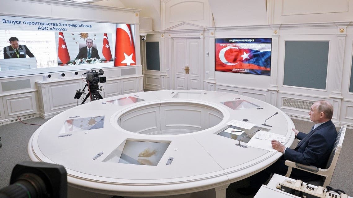 Russian President Vladimir Putin looks at a screen showing Turkish President Tayyip Erdogan as he attends a foundation-laying ceremony for the third reactor of the Akkuyu nuclear plant in Turkey, via a video link in Moscow, Russia, on March 10, 2021. (Reuters)