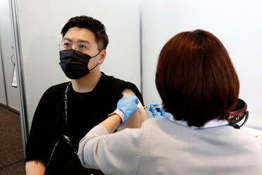 A man receives the Moderna coronavirus vaccine at the Tokyo Metropolitan Government building in Tokyo, Japan, on June 25, 2021. (Reuters)