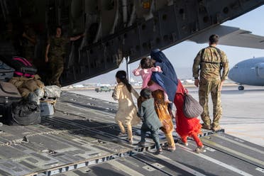 US Air Force loadmasters and pilots assigned to the 816th Expeditionary Airlift Squadron, load passengers aboard a US Air Force C-17 Globemaster III in support of the Afghanistan evacuation at Hamid Karzai International Airport in Kabul, Afghanistan, August 24, 2021. (Reuters)