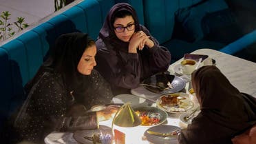 Saudi women sit at David Burke’s restaurant, in The Zone restaurant complex, in Riyadh, Saudi Arabia, on August 25, 2021. (Reuters)