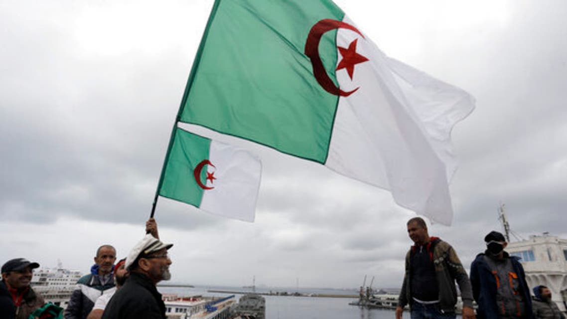 Algerians demonstrate iwith flags along the docks of Algiers, Friday, April 16, 2021. (AP)