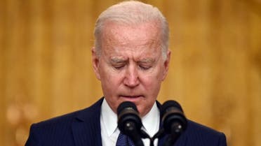 US President Joe Biden pauses as he delivers remarks on the terror attack at Hamid Karzai International Airport, and the US service members and Afghan victims killed and wounded, in the East Room of the White House, Washington, DC on August 26, 2021.  (AFP)