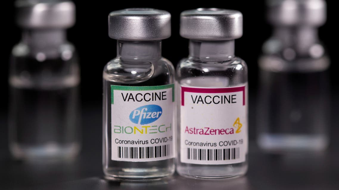 Vials with Pfizer-BioNTech and AstraZeneca coronavirus disease (COVID-19) vaccine labels are seen in this illustration picture taken March 19, 2021. (Reuters)