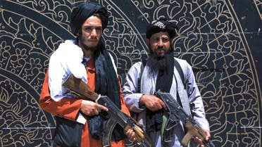 Taliban fighters stand guard in front of the provincial governor's office in Herat on August 14, 2021. (AFP)