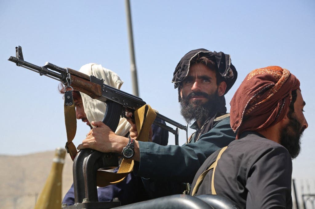 Taliban fighters stand guard in a vehicle along the roadside in Kabul on August 16, 2021. (File photo: AFP)