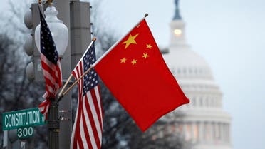 China flag and the U.S. flag fly on a lamp post along Pennsylvania Avenue near the U.S. Capitol in Washington. (File photo: Reuters)