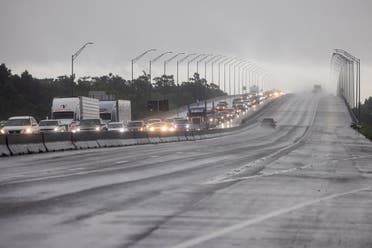 Traffic moves bumper to bumper along I-10 west as residents arrive into Texas from the Louisiana border ahead of Hurricane Ida in Orange, Texas, US, August 28, 2021. (Reuters)