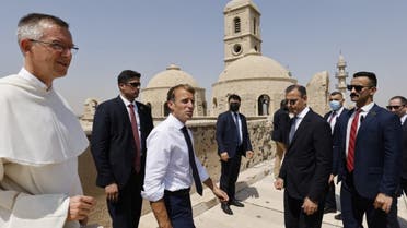 ماكرون يزور مسجد النوري وكنيسة الساعة في الموصل (أ ف ب)