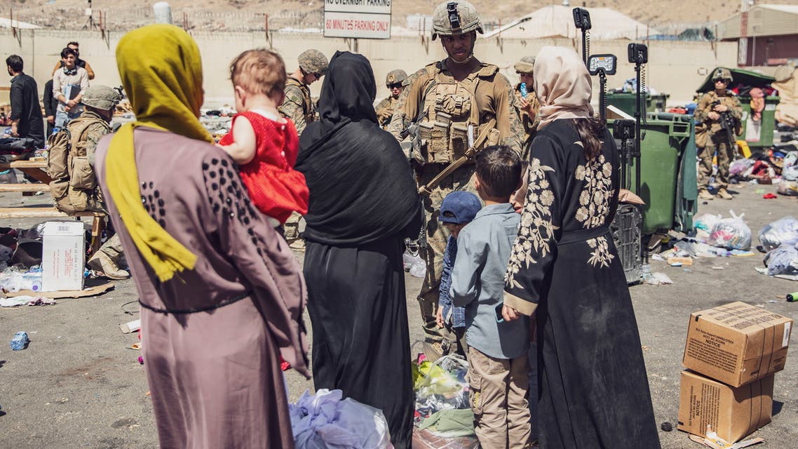 US Marine process evacuees during an evacuation at Hamid Karzai International Airport, in Kabul, August 28, 2021. (Reuters)