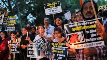 Supporters of India's main opposition Congress party attend a candlelight vigil to protest against the alleged rape and murder of a 9-year-old girl in New Delhi, India, August 4, 2021. (Reuters)