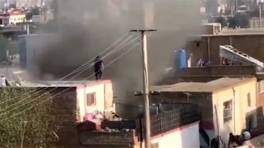 Smoke rises from a house in Kabul after child was killed in a rocket attack northwest of Kabul airport, according to an Afghan police chief. (Twitter)