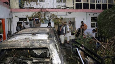 Afghan people are seen inside a house after US drone strike in Kabul, Afghanistan, Sunday, Aug. 29, 2021. (AP)