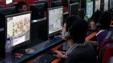 People play online games in an internet cafe in downtown Shanghai August 6, 2009. (Reuters)